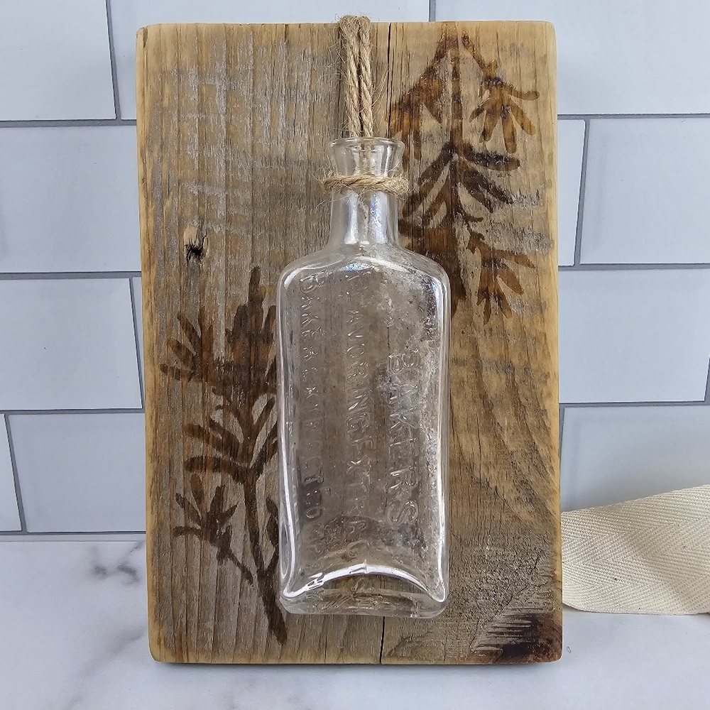 handcrafted from barnwood, an old bottle, pretty leaf embossing